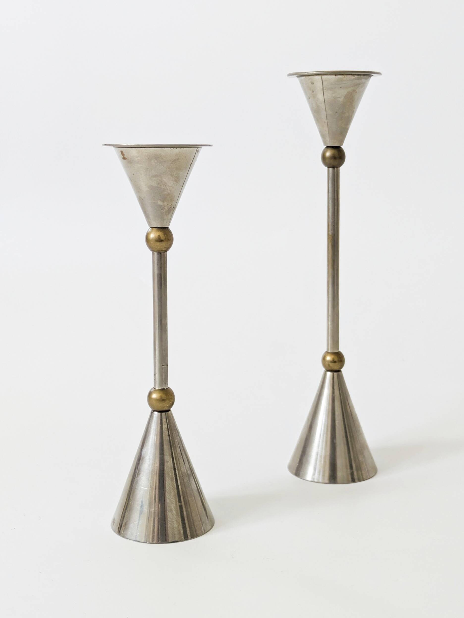 Pair of postmodern candlesticks in Memphis style made of steel and brass.