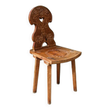 Old Swiss escabelle chair in carved wood