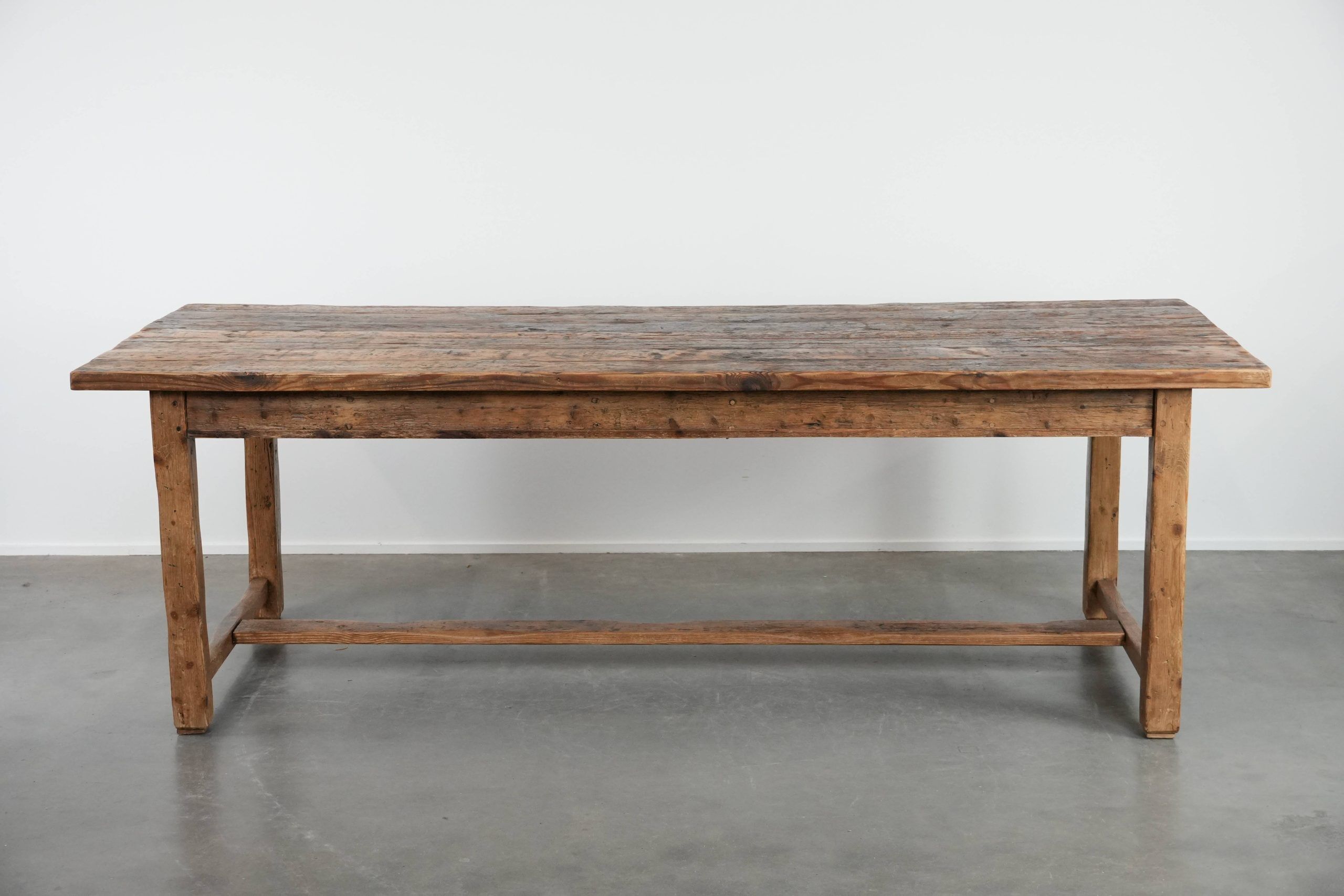 Magnificent and robust antique farmhouse dining table made of pine wood