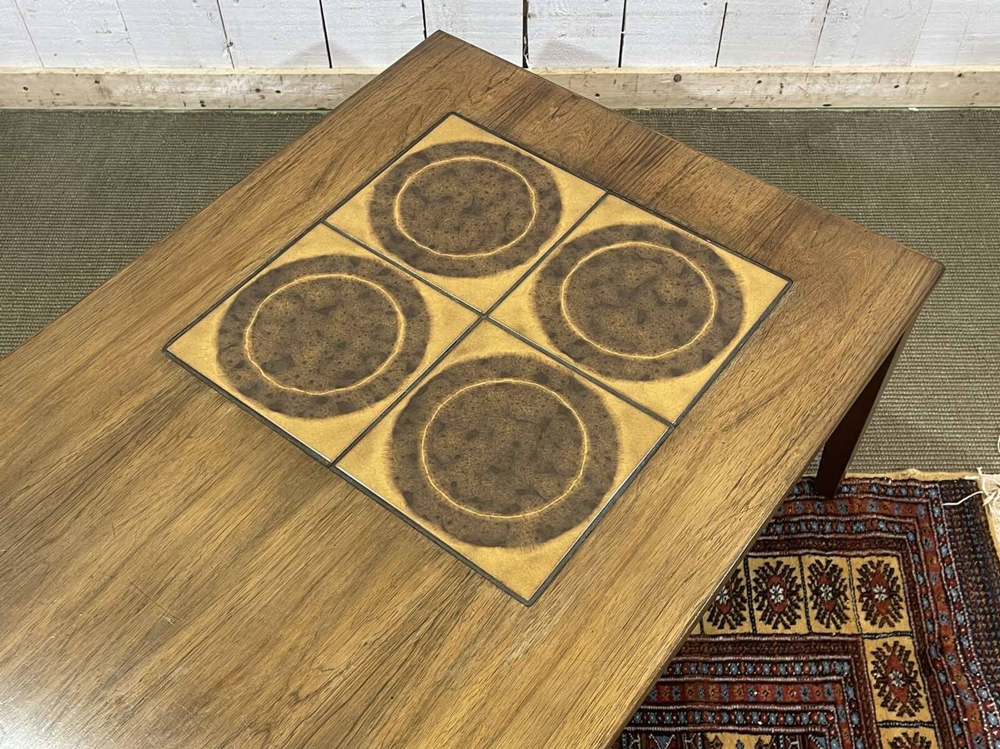 English coffee table in rosewood with tiled section from the 1970s.
