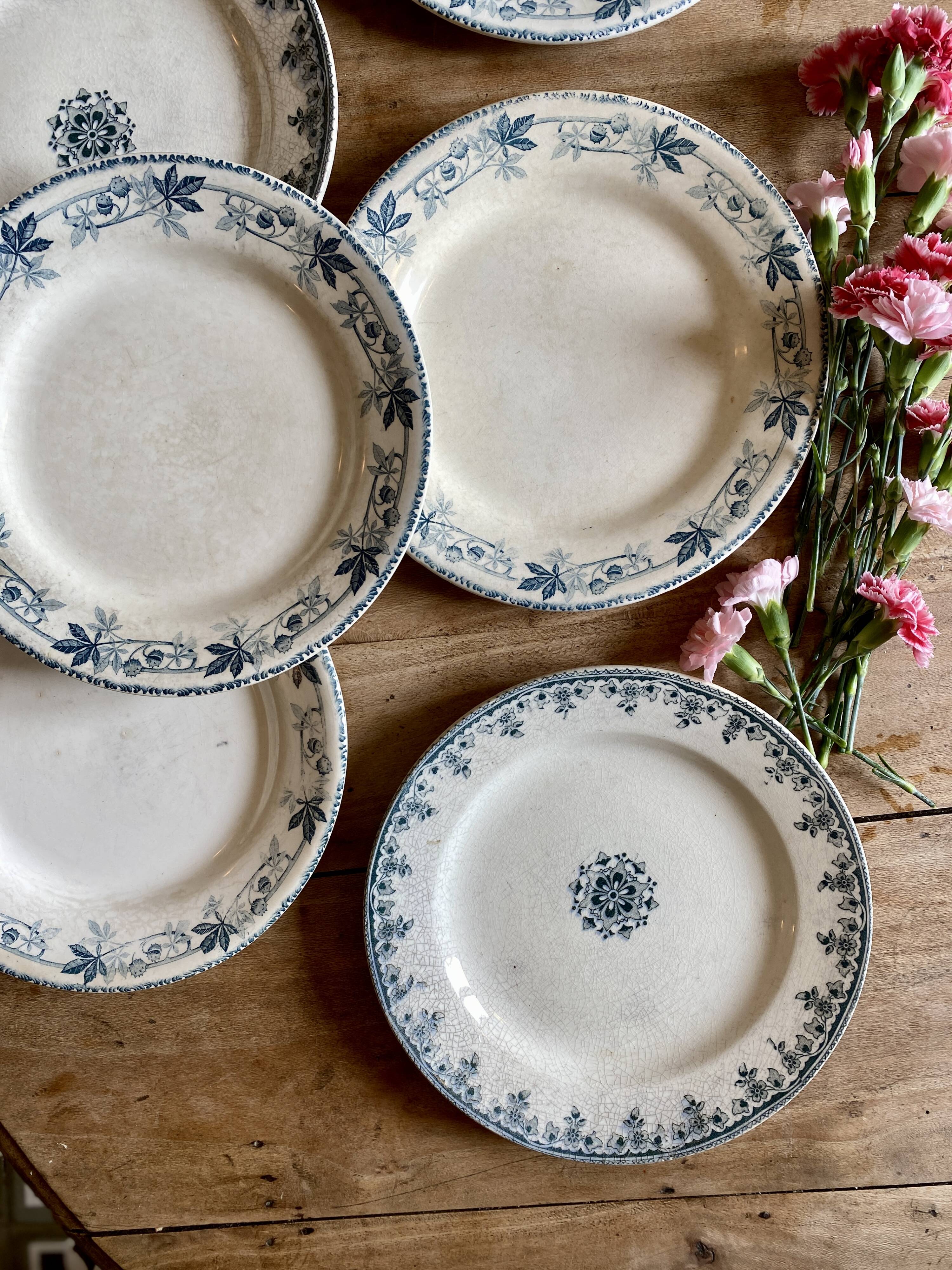 Set of 6 mismatched old iron earth flat plates