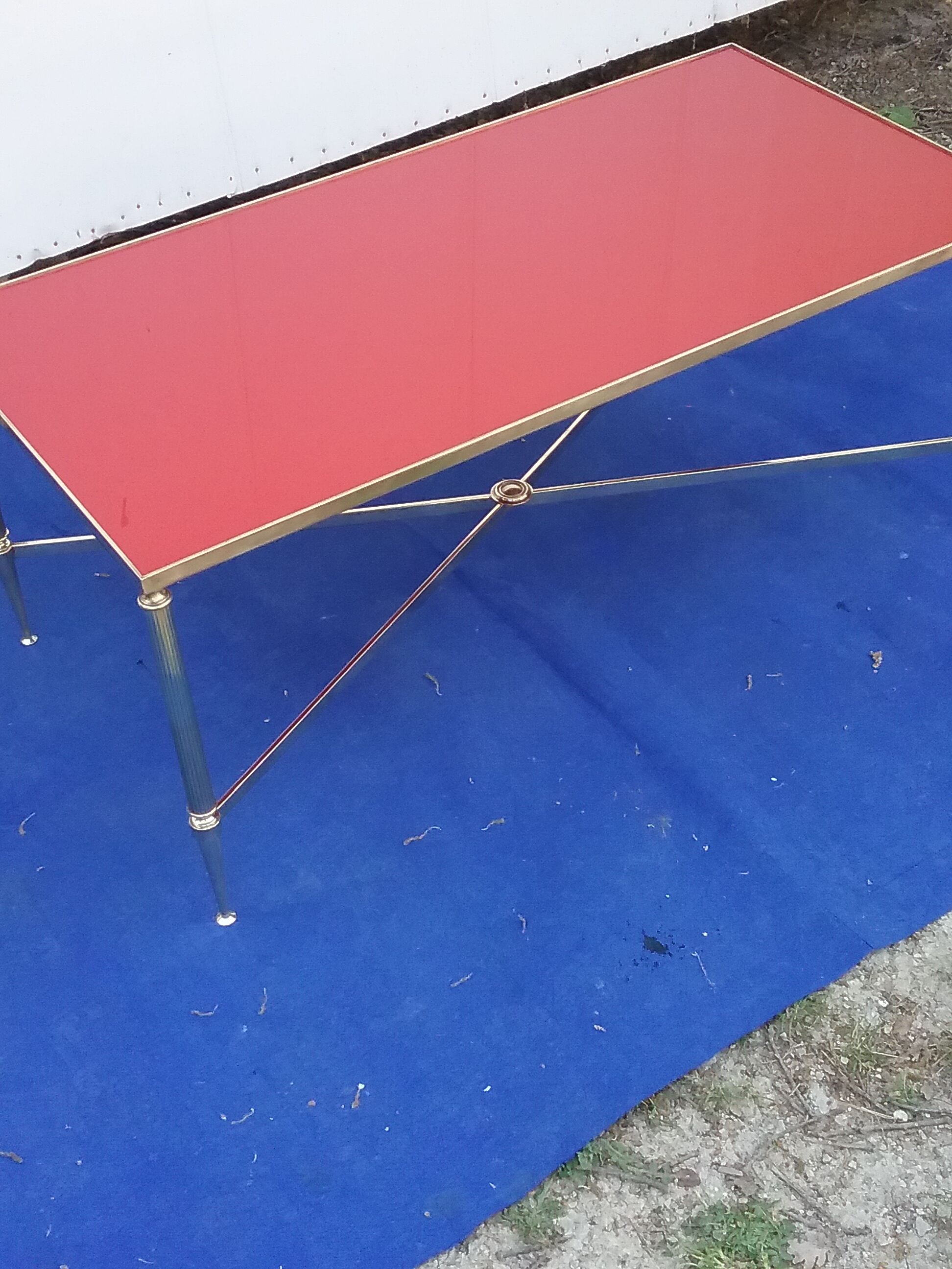 Brass coffee table with red glass top