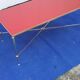 Brass coffee table with red glass top