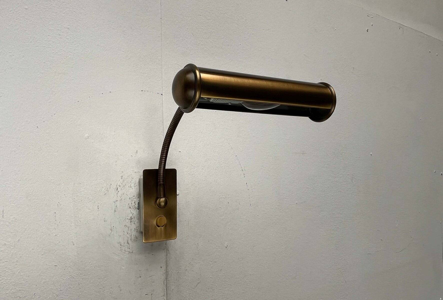 Vintage German brass patinated wall lamp with a gooseneck design by Honsel, 1970s.