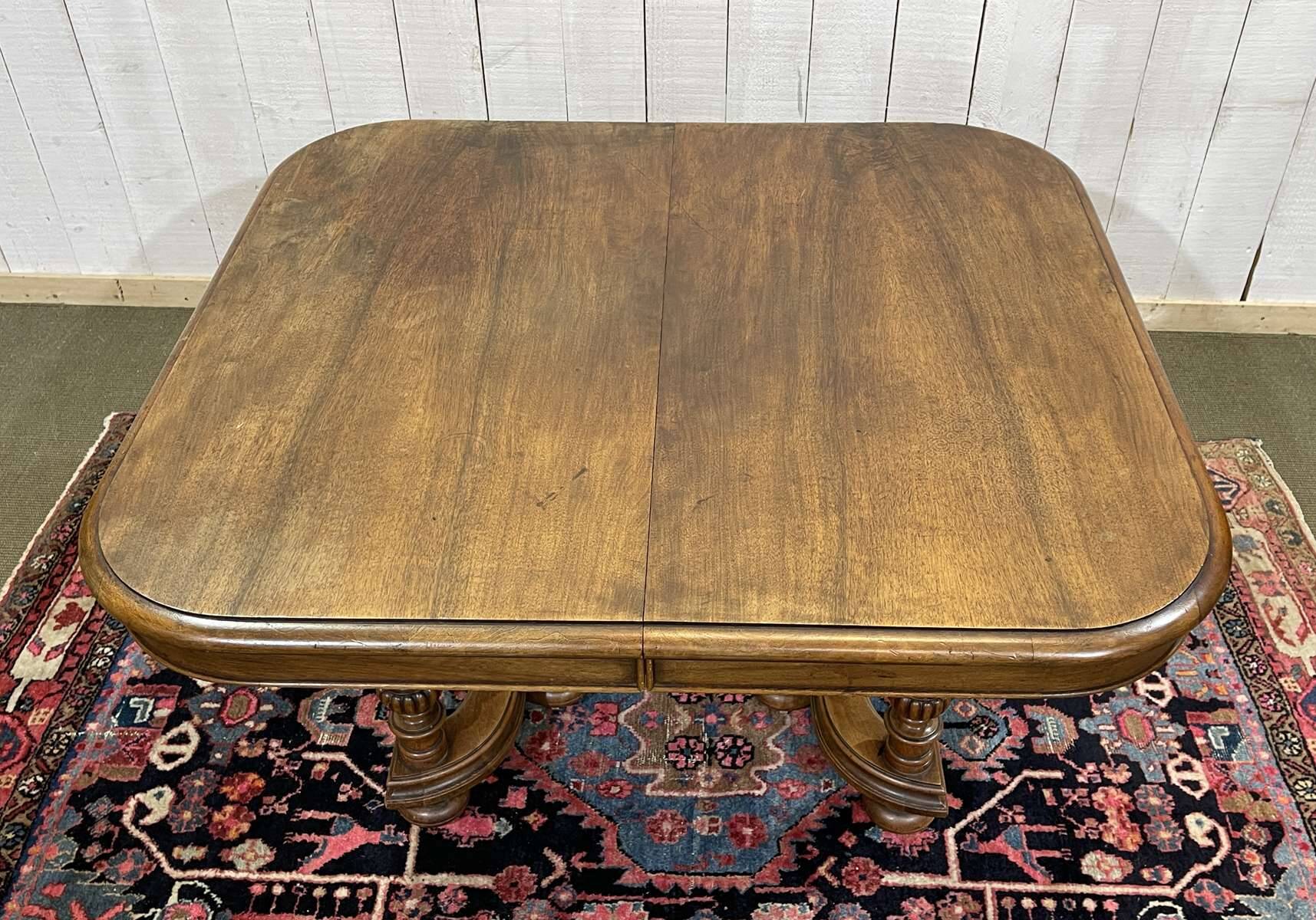 Henri II walnut table from the early 20th century with extensions.