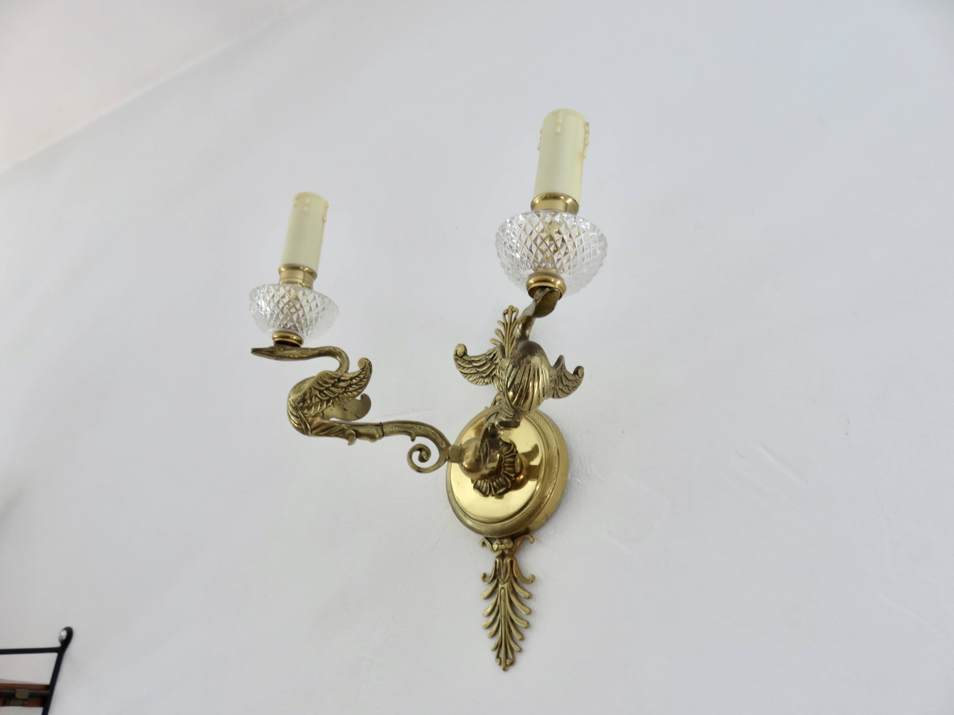 Pair of Lucien Gau "swan" wall lights in gilded bronze with bright gold and crystal