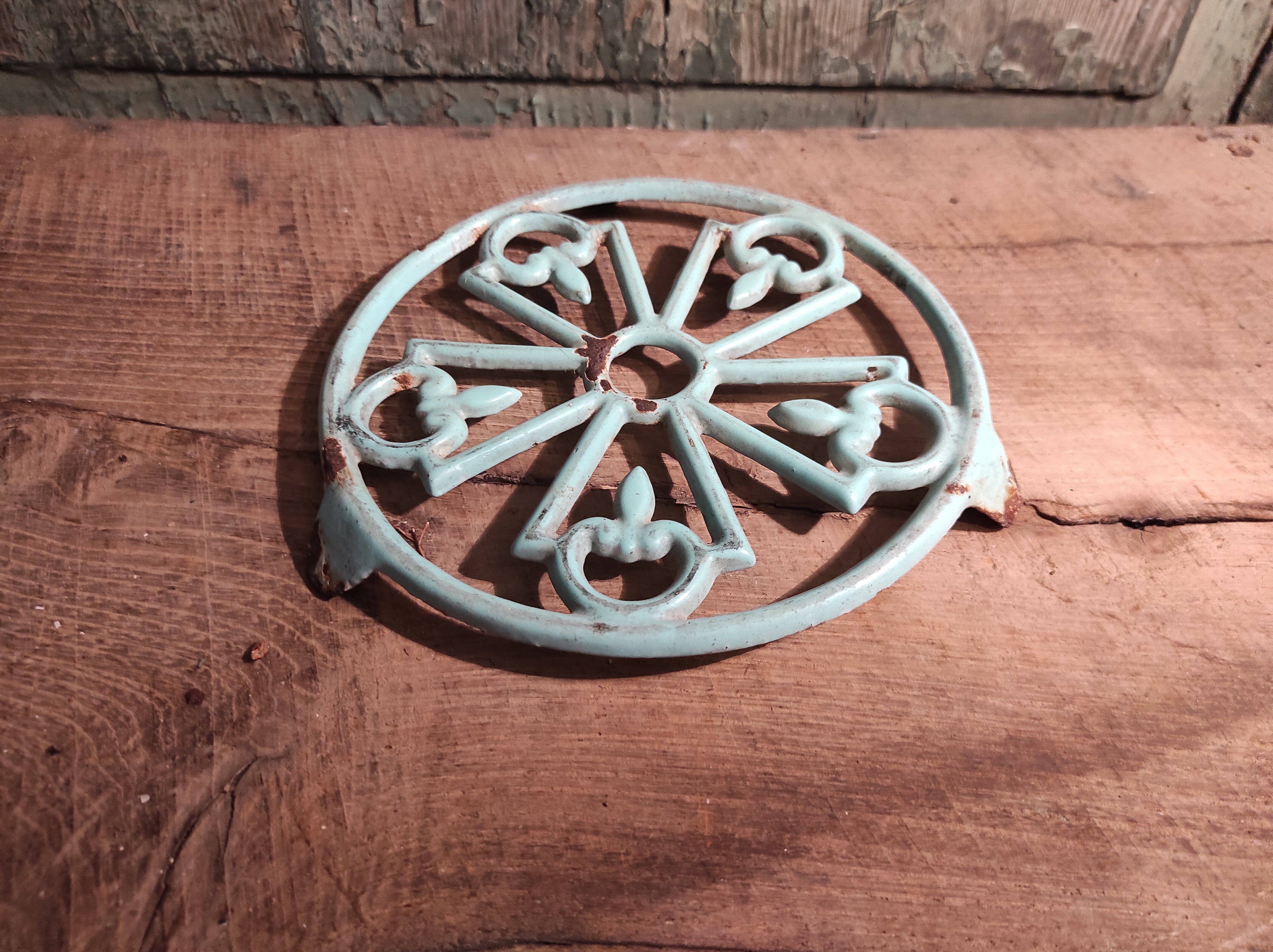 Vintage French light greenish blue cast iron table mat