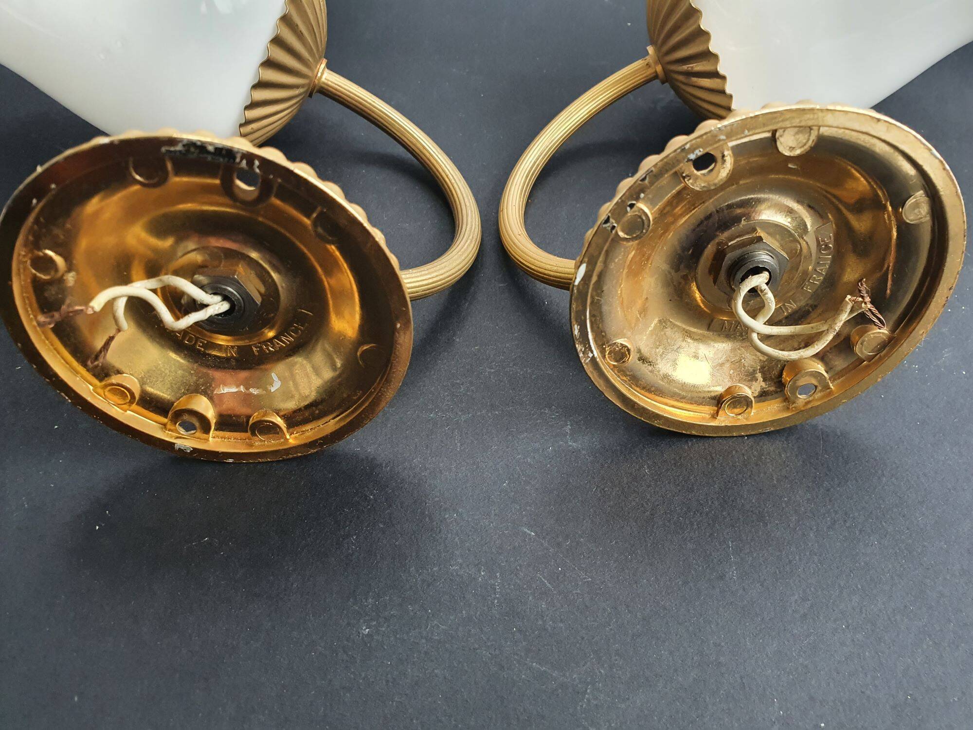 Pair of vintage gold-tone wall sconces with opaline glass globes