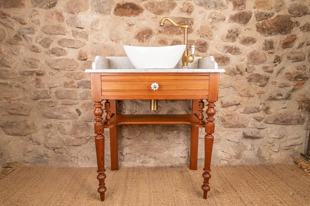 Antique washbasin cabinet in solid pitch pine with a white marble top.