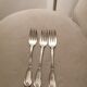 3 silver metal forks