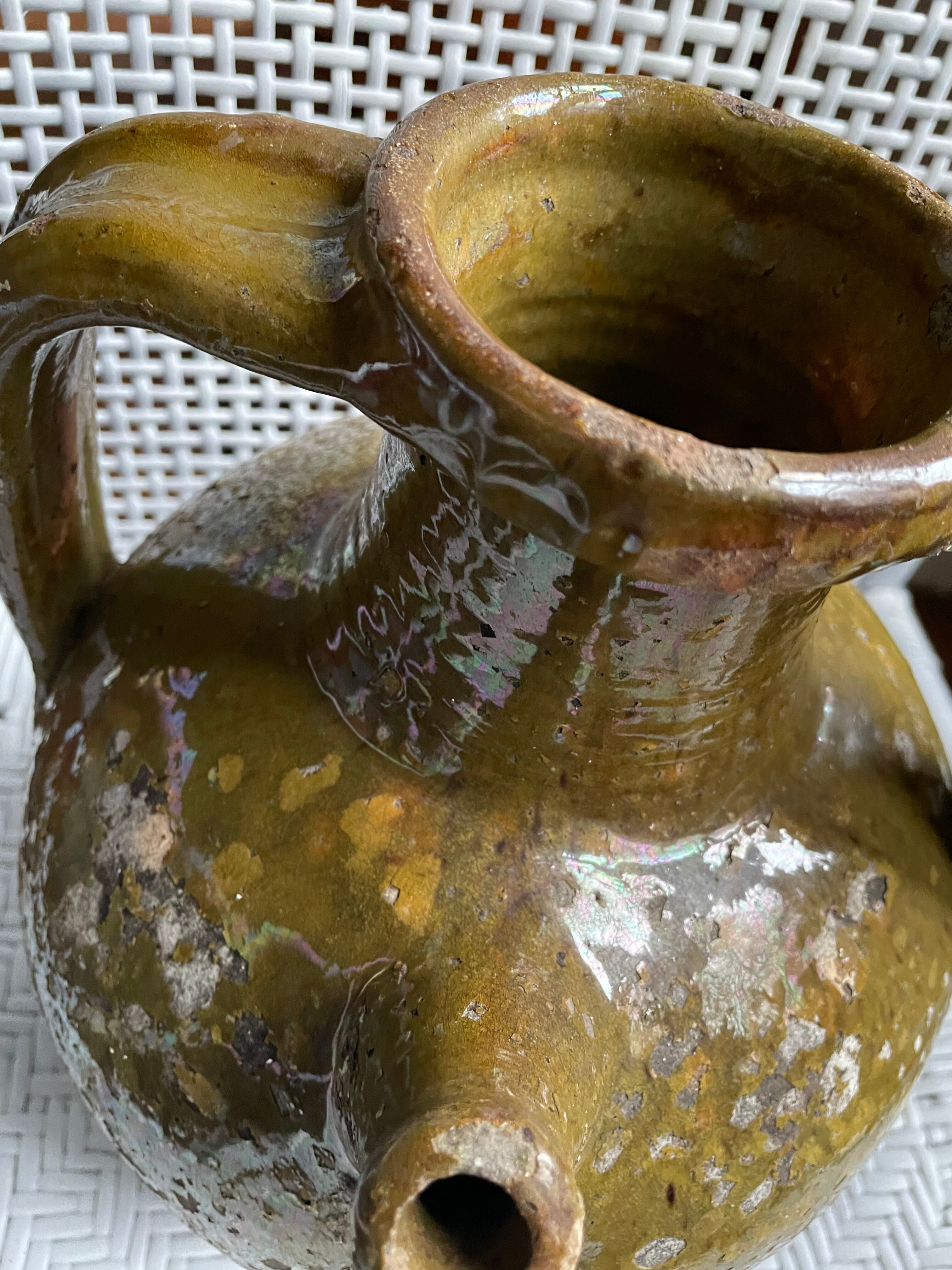 Khaki green glazed terracotta oil jar, 18th-19th century