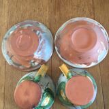 Two cups and their hand-painted ceramic saucer