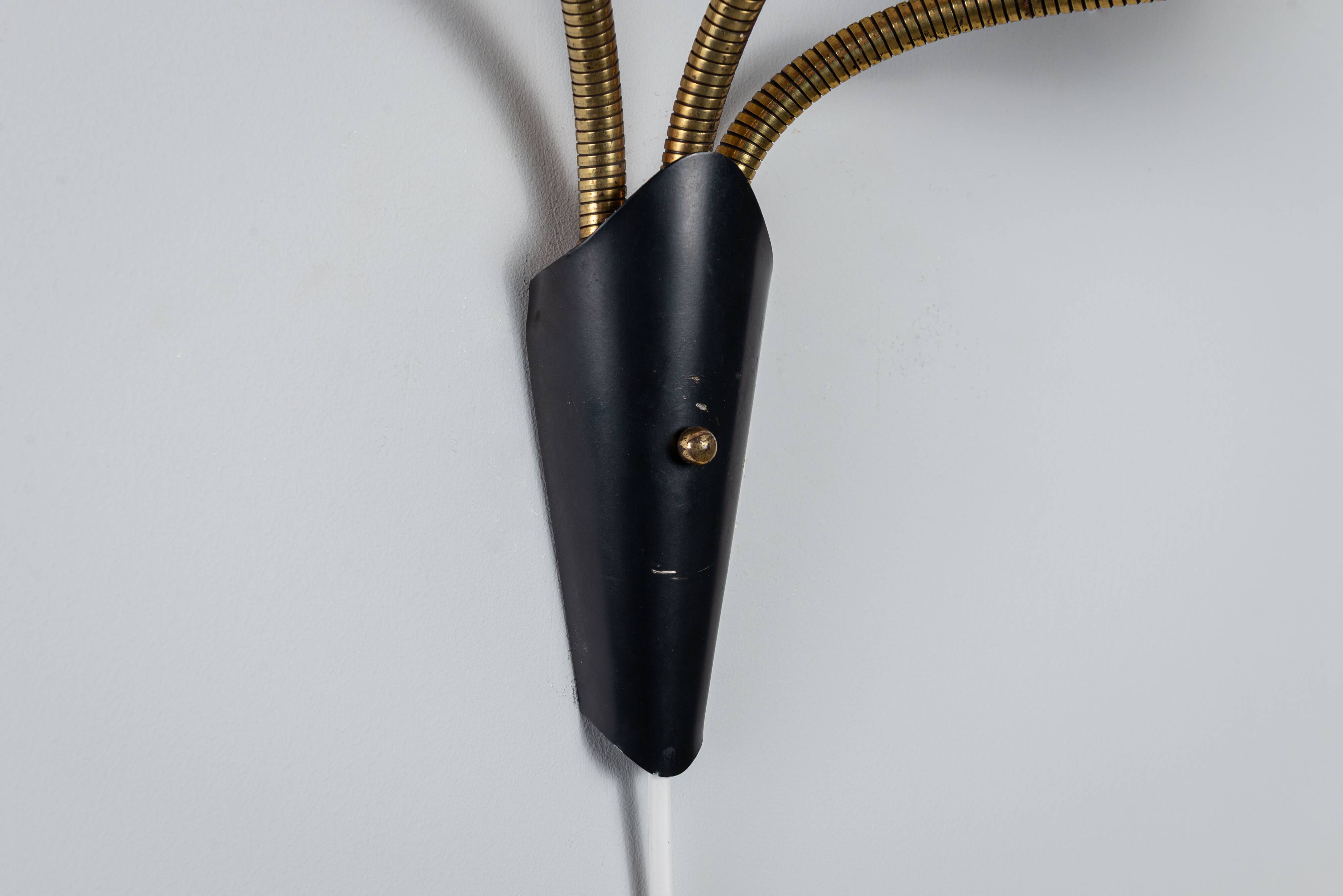 Adjustable wall lamp with three decorated shades in different colours