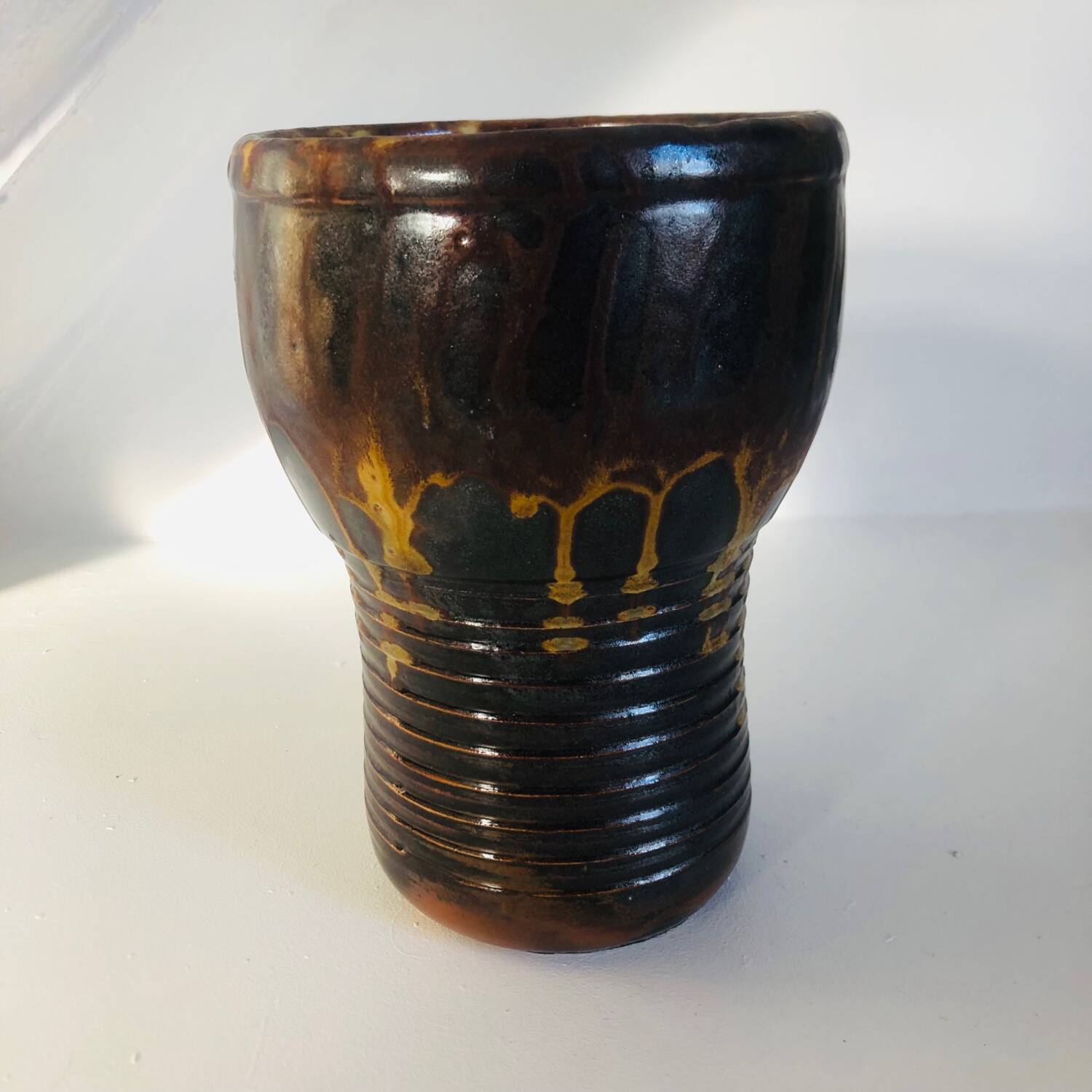Metallic brown ceramic torso vase