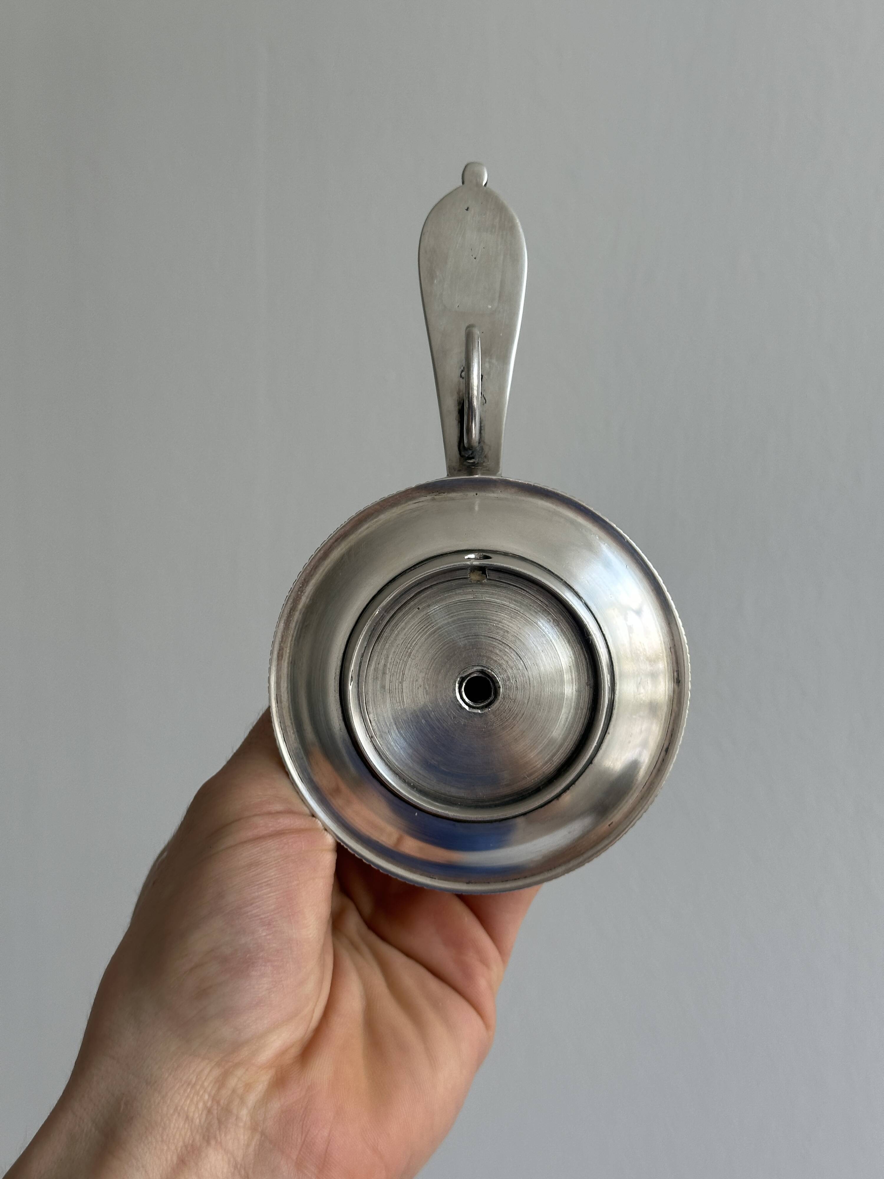 Pair of shiny silver metal candlesticks