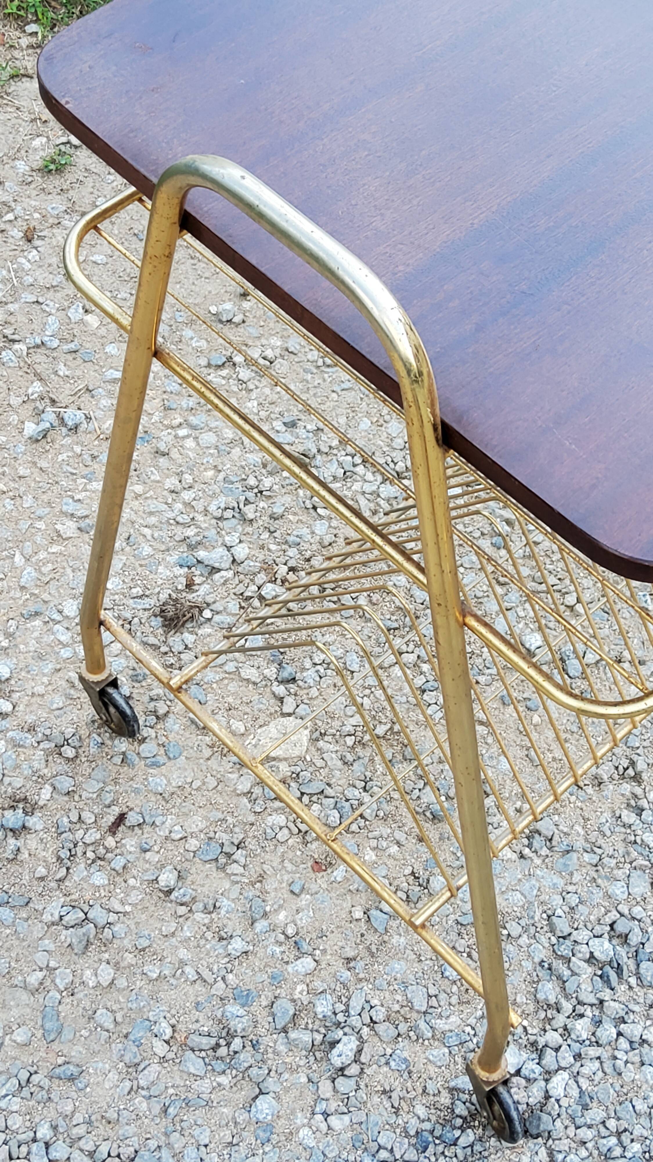 Side table of the 60s mahogany and gold metal range discs