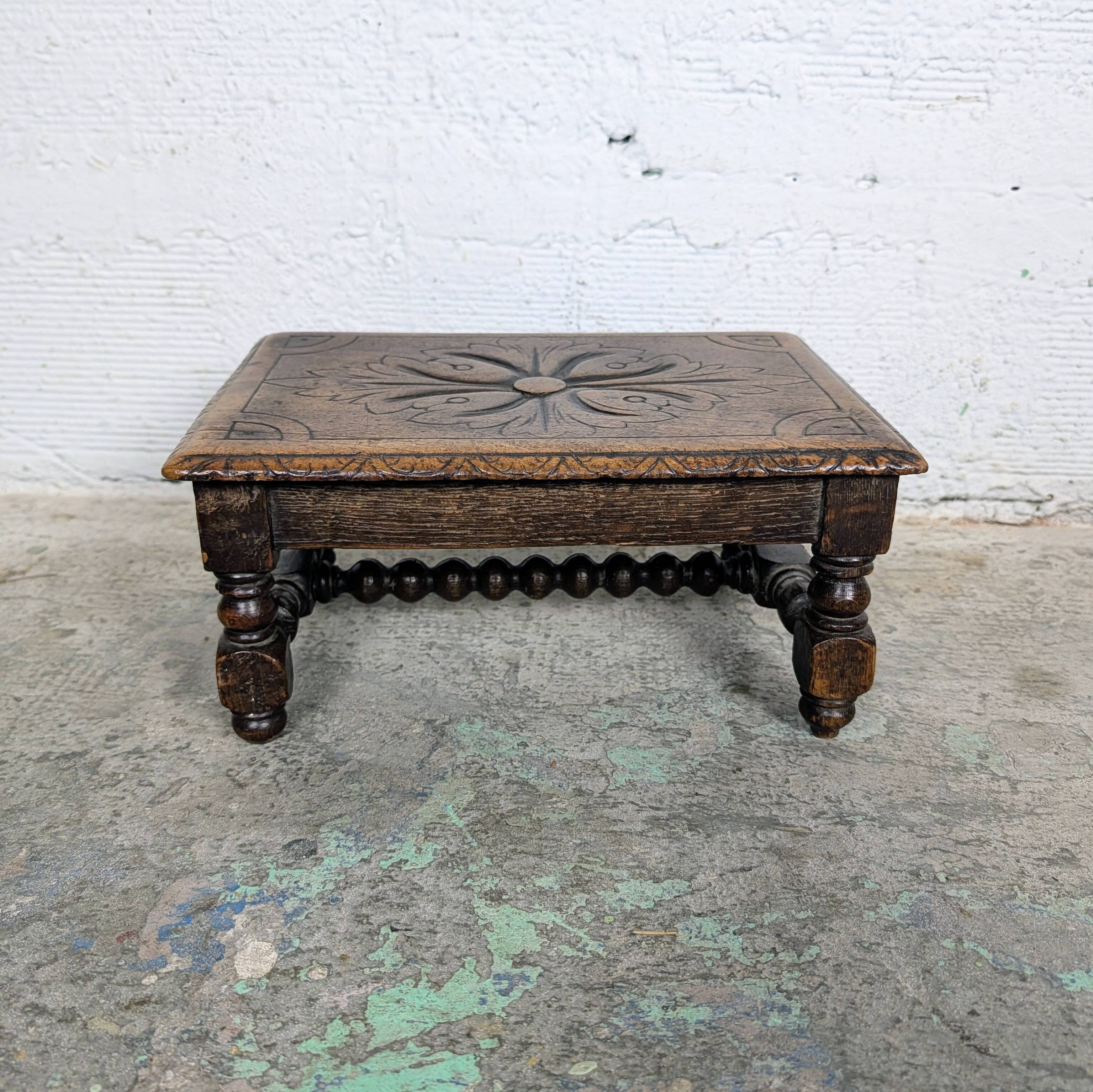 Carved wooden footrest
