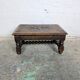 Carved wooden footrest