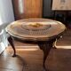Round coffee table in Louis XV style, with sun cane and glass top.