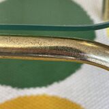 Pair of small nesting coffee tables in gold tubular metal & transparent glass tops