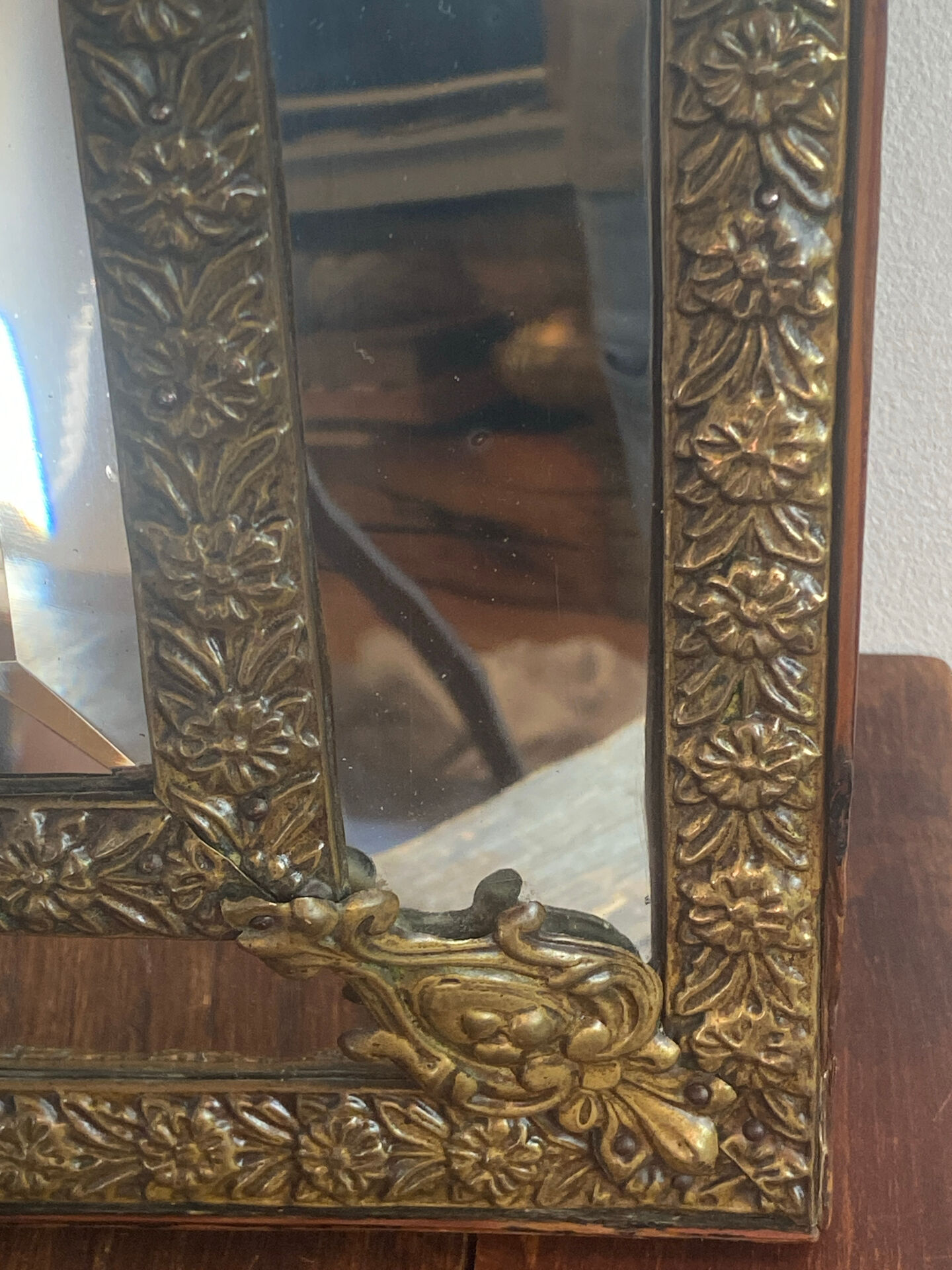 Mirror with brass repoussé frame