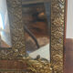 Mirror with brass repoussé frame
