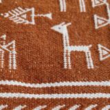 White and brown kilim carpet with gazelle patterns