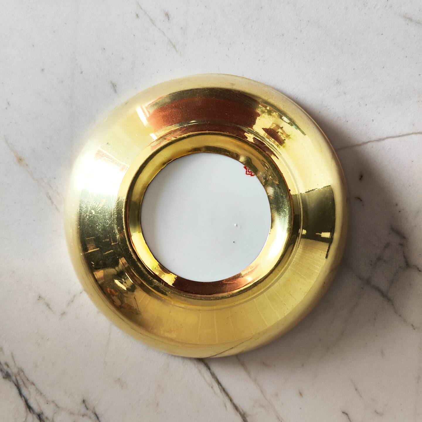 Porcelain and brass bowl