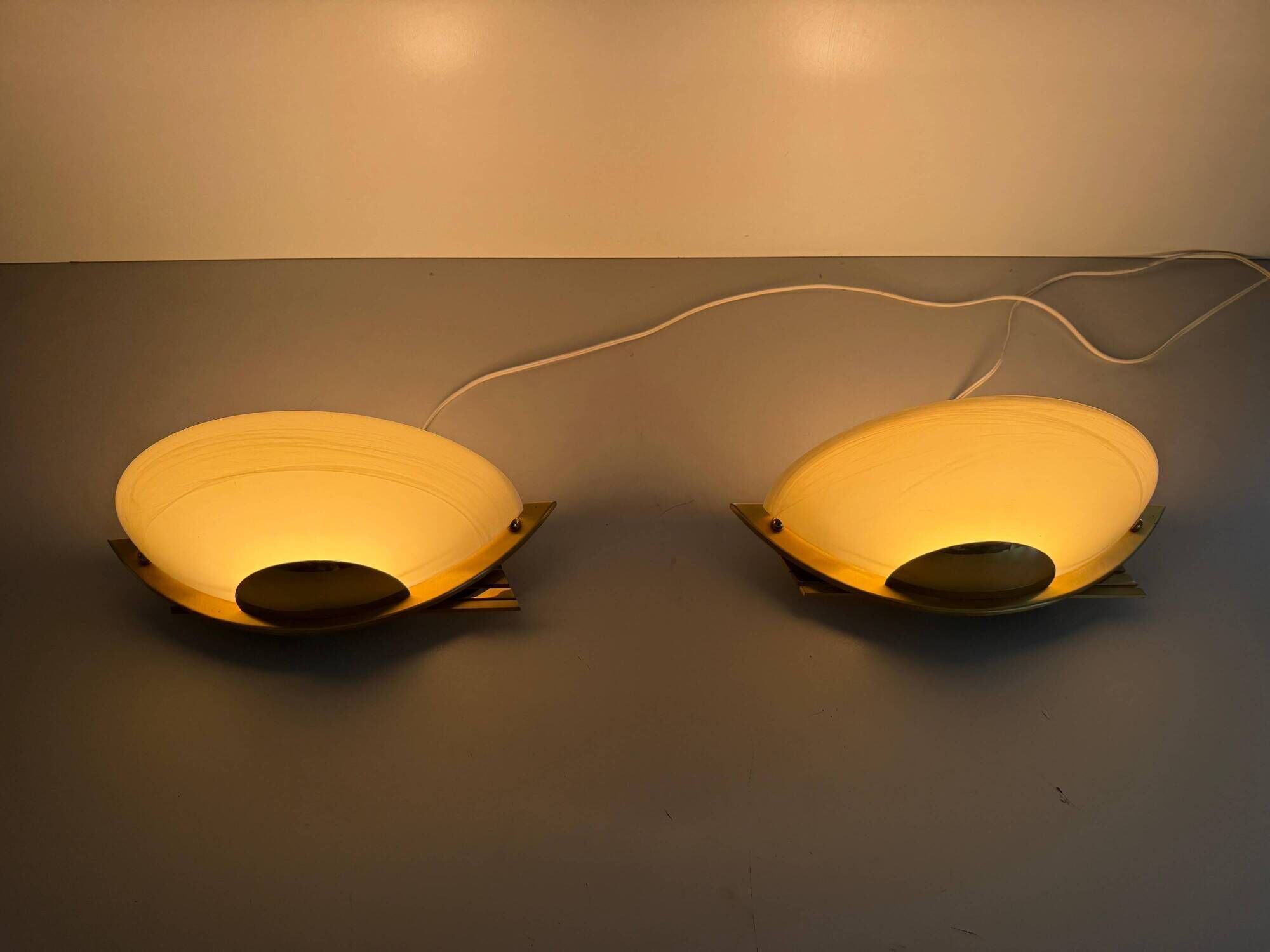 Pair of brass and glass wall lights from the Spage era, 1980, Germany.