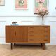 Small vintage Scandinavian teak sideboard.