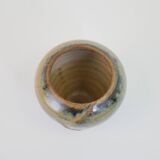 Small beige glazed ceramic vase with abstract relief pattern
