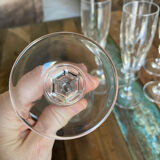 Set of 7 champagne flutes. Made of cut crystal.