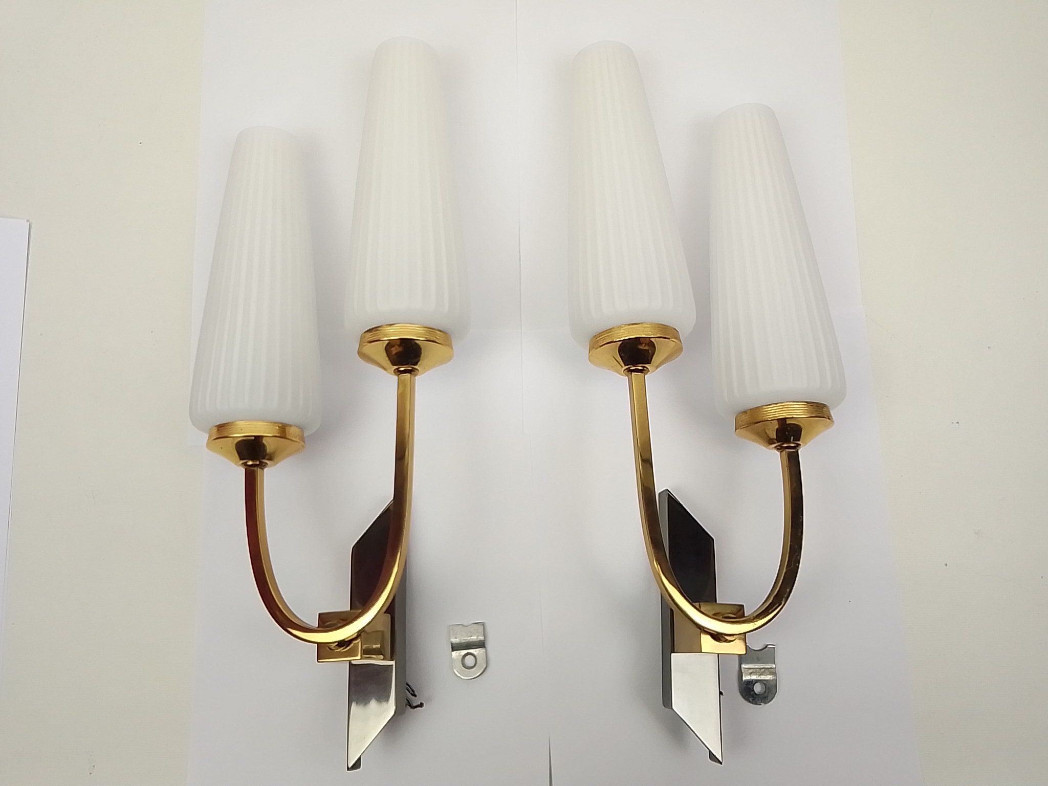 Pair of wall lamps in gilded metal and opaline style white glass