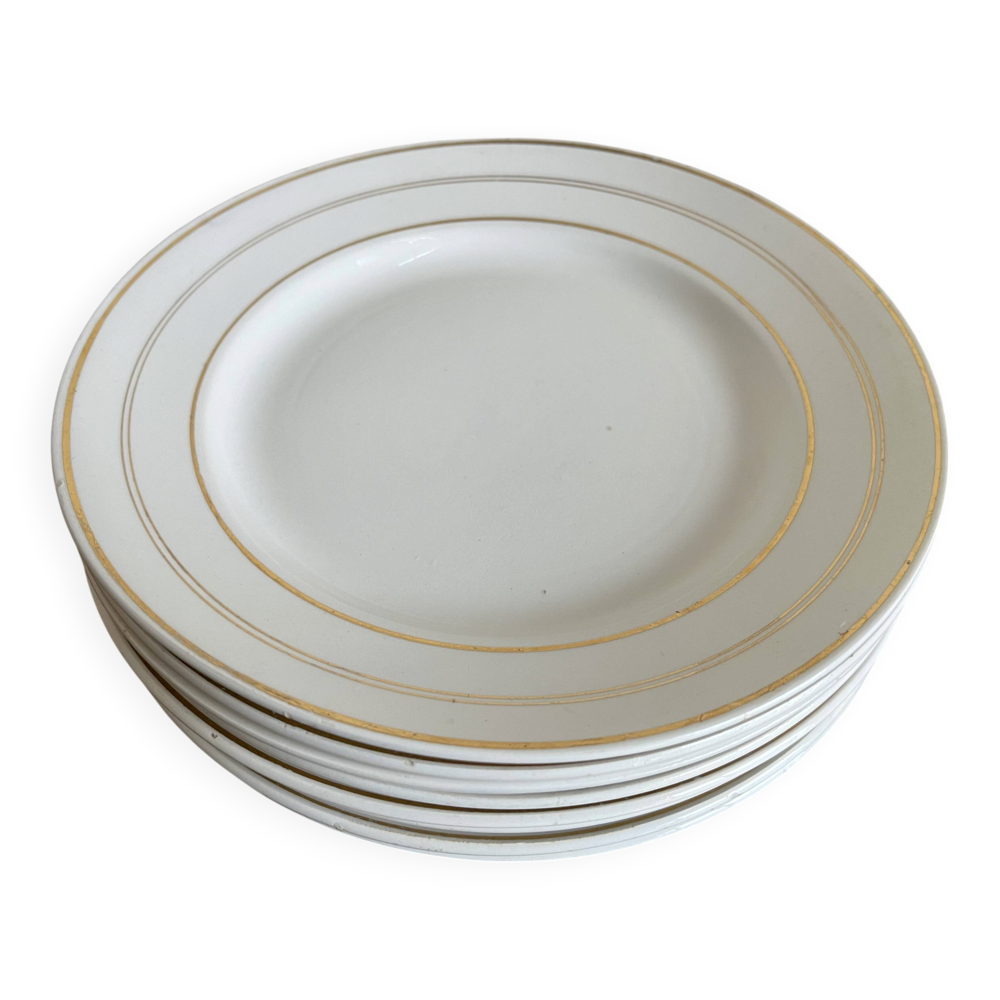 Set of 8 modernist flat plates in fine earthenware with pure gold trim, 1930.