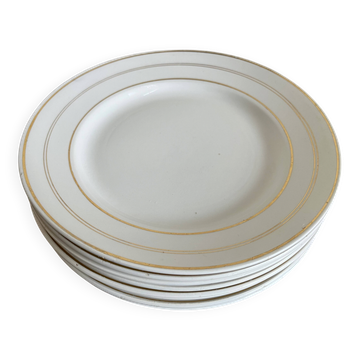 Set of 8 modernist flat plates in fine earthenware with pure gold trim, 1930.