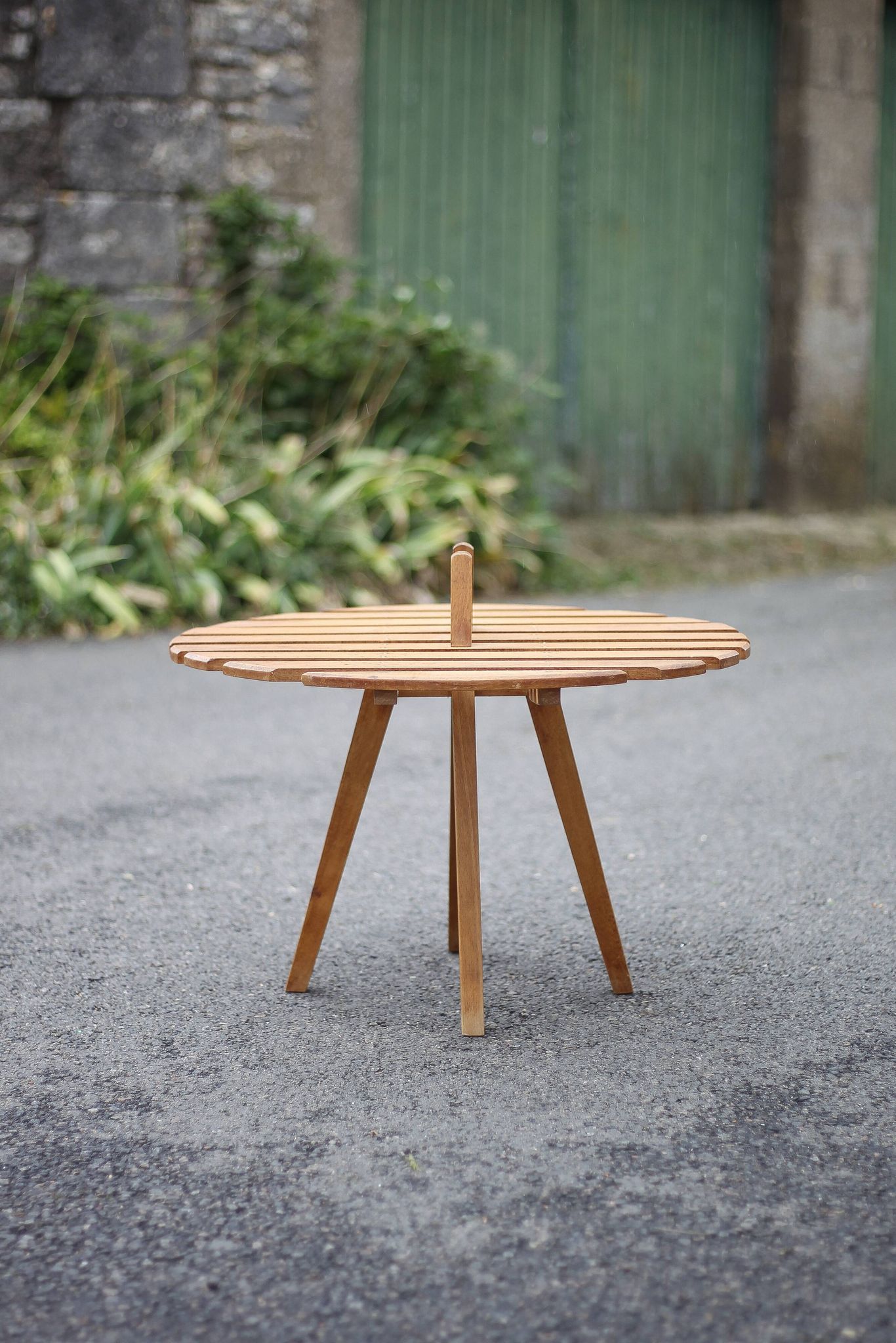 Vintage coffee table, wooden table with central handle, interior decoration, terrace, patio