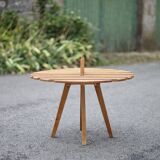 Vintage coffee table, wooden table with central handle, interior decoration, terrace, patio
