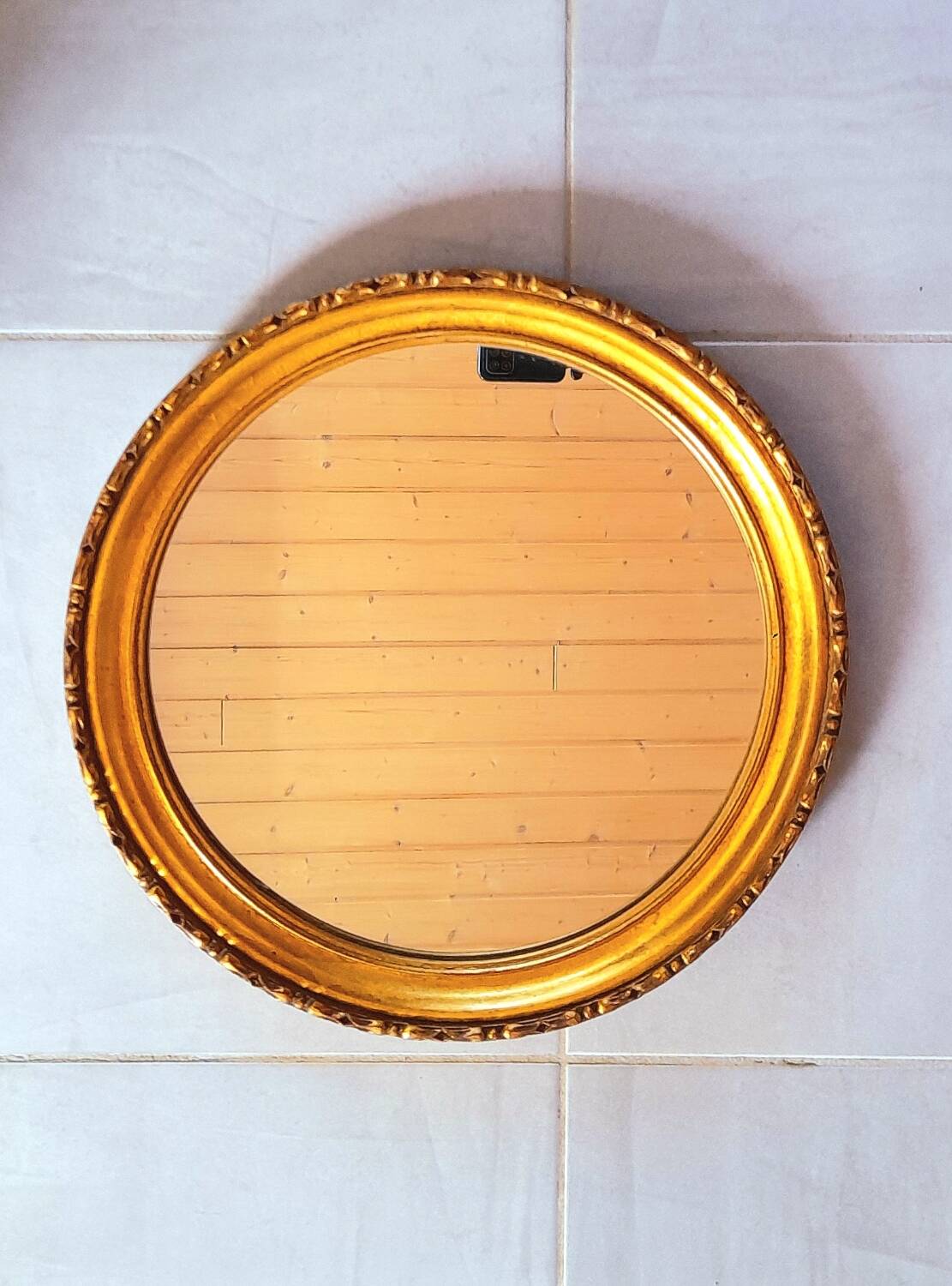 Round golden mirror