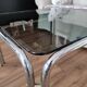 Table basse piètement chromé et plateau en verre fumé noir