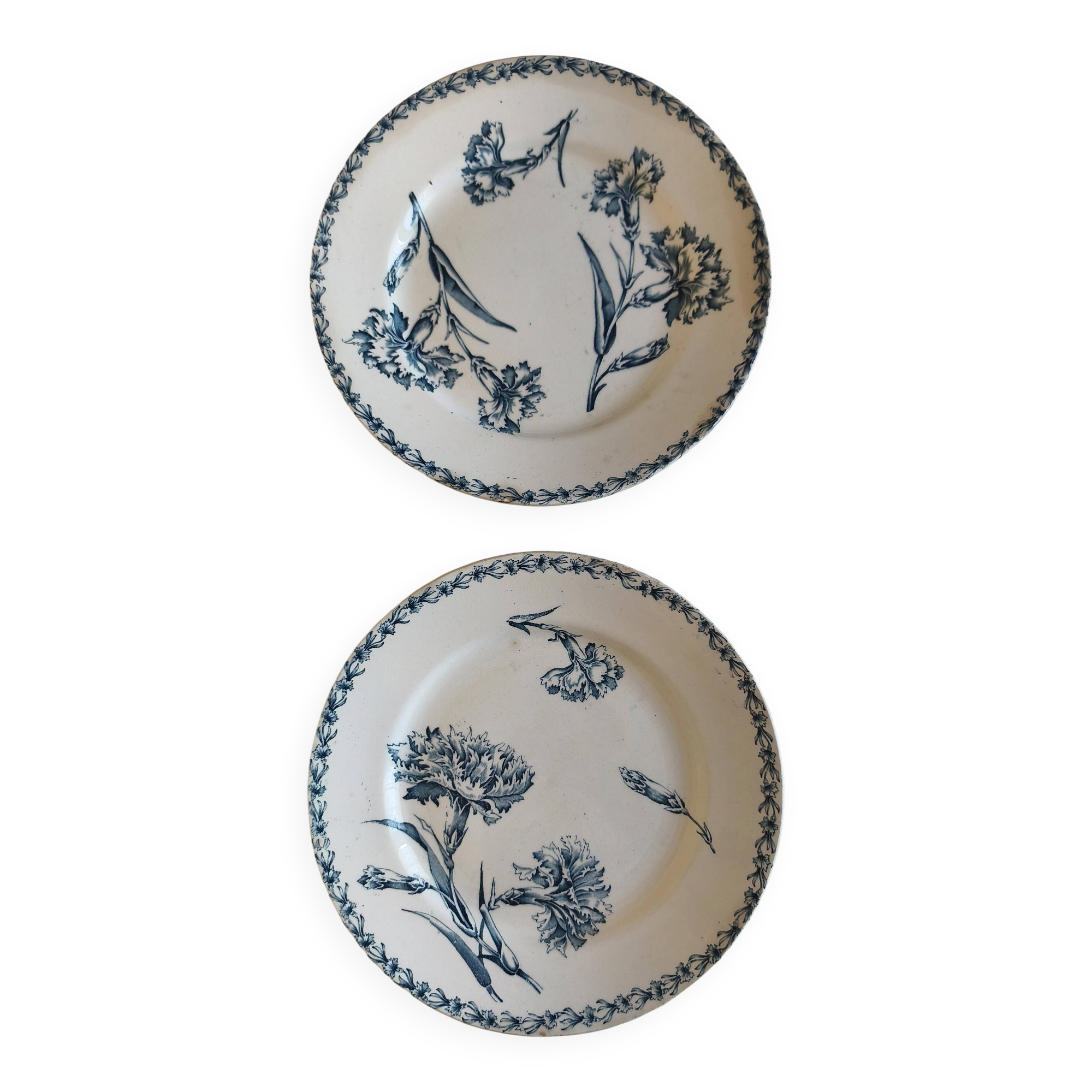 Two ironstone plates from Lunéville Keller and Guérin with a floral pattern.