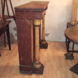 19th century wooden fireplace, faux marble paint. Can act as a console.