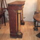 19th century wooden fireplace, faux marble paint. Can act as a console.