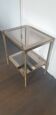 Double tray side table in brass and smoked glass.