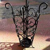 Antique wrought iron umbrella stand for entrance hall, vintage decor.