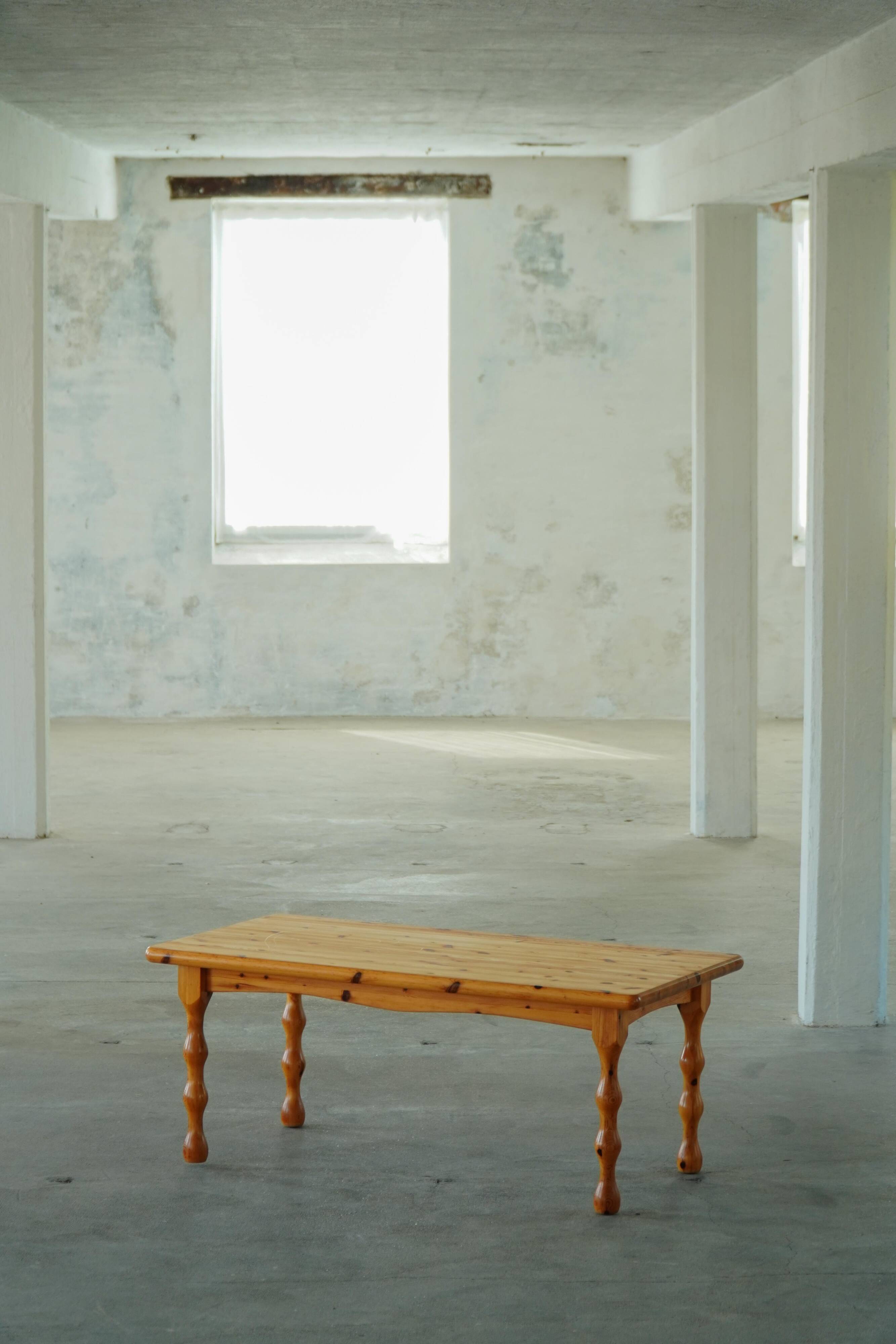Scandinavian coffee table in brutalist style made of pine, with turned legs, Danish modern style, 1970s.