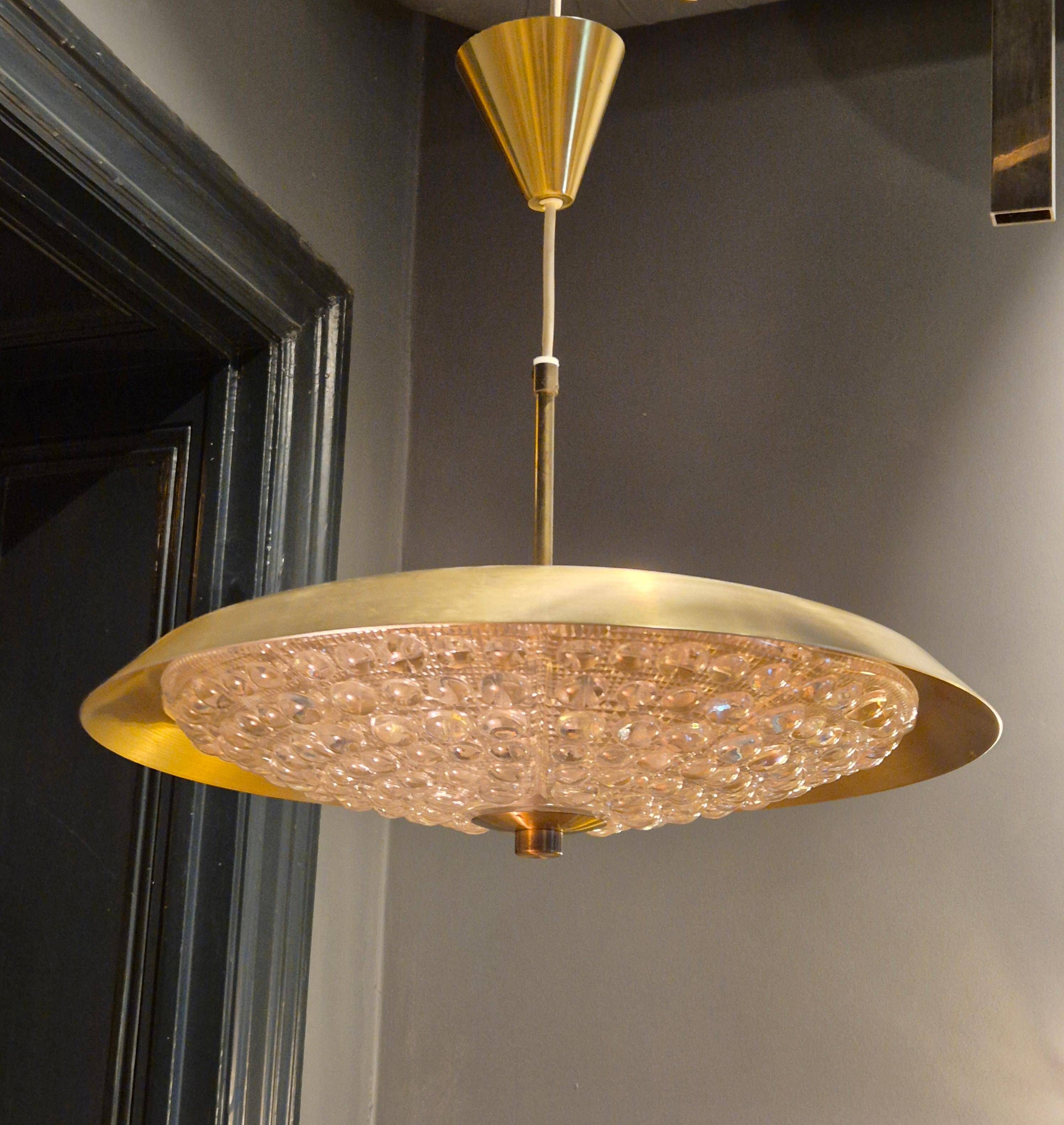 Carl Fagerlund, modern Swedish pendant in brass and beautiful Orrefors glass.