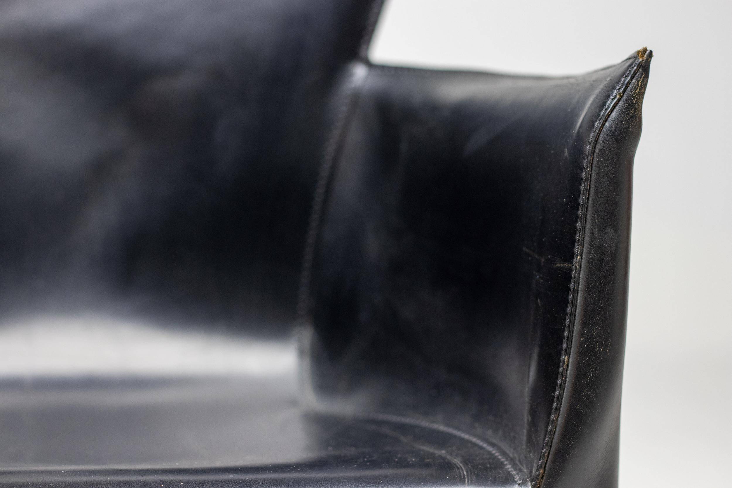 Set of four Vela leather armchairs by Carlo Bartoli - Italian modern elegance.
