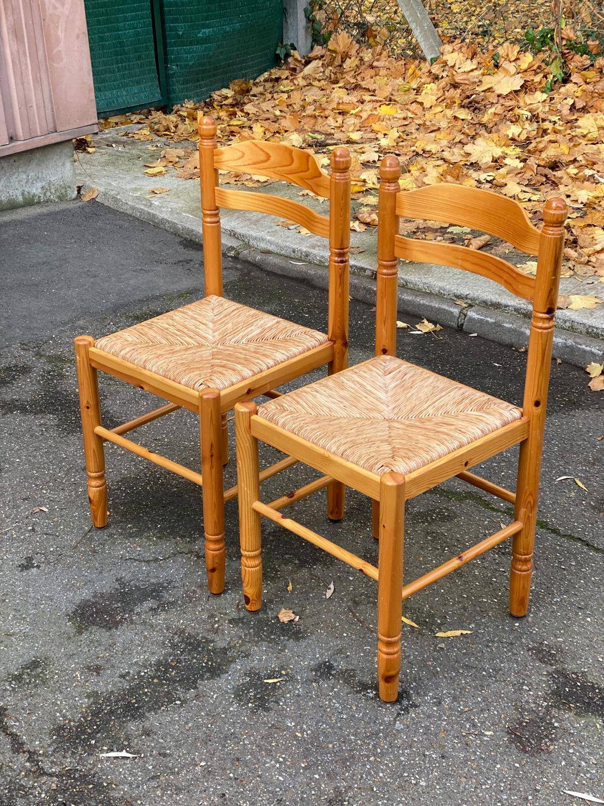 2 straw-seated chairs in light-colored solid wood