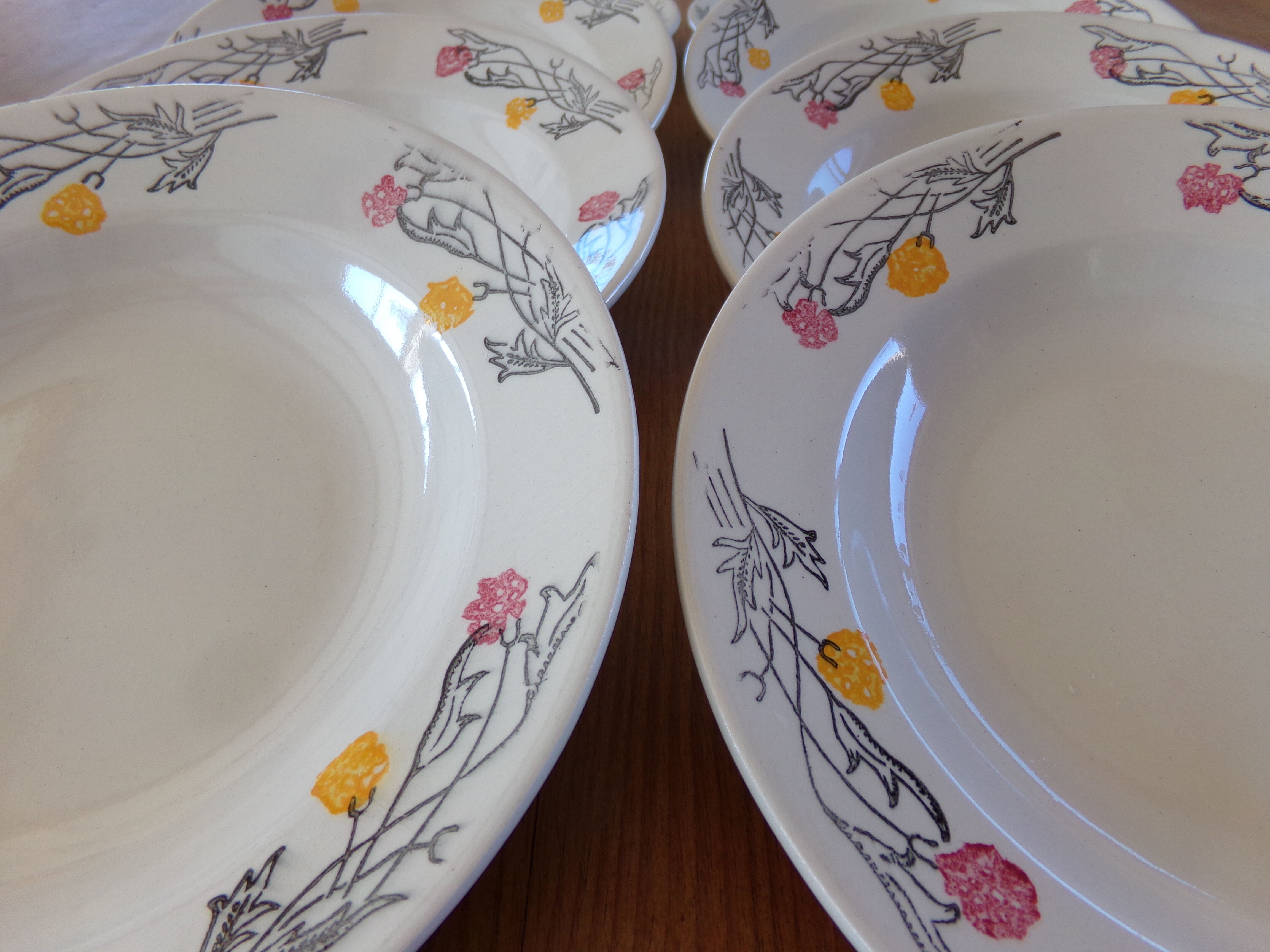 4 hollow plates and 4 old flat plates with floral decoration