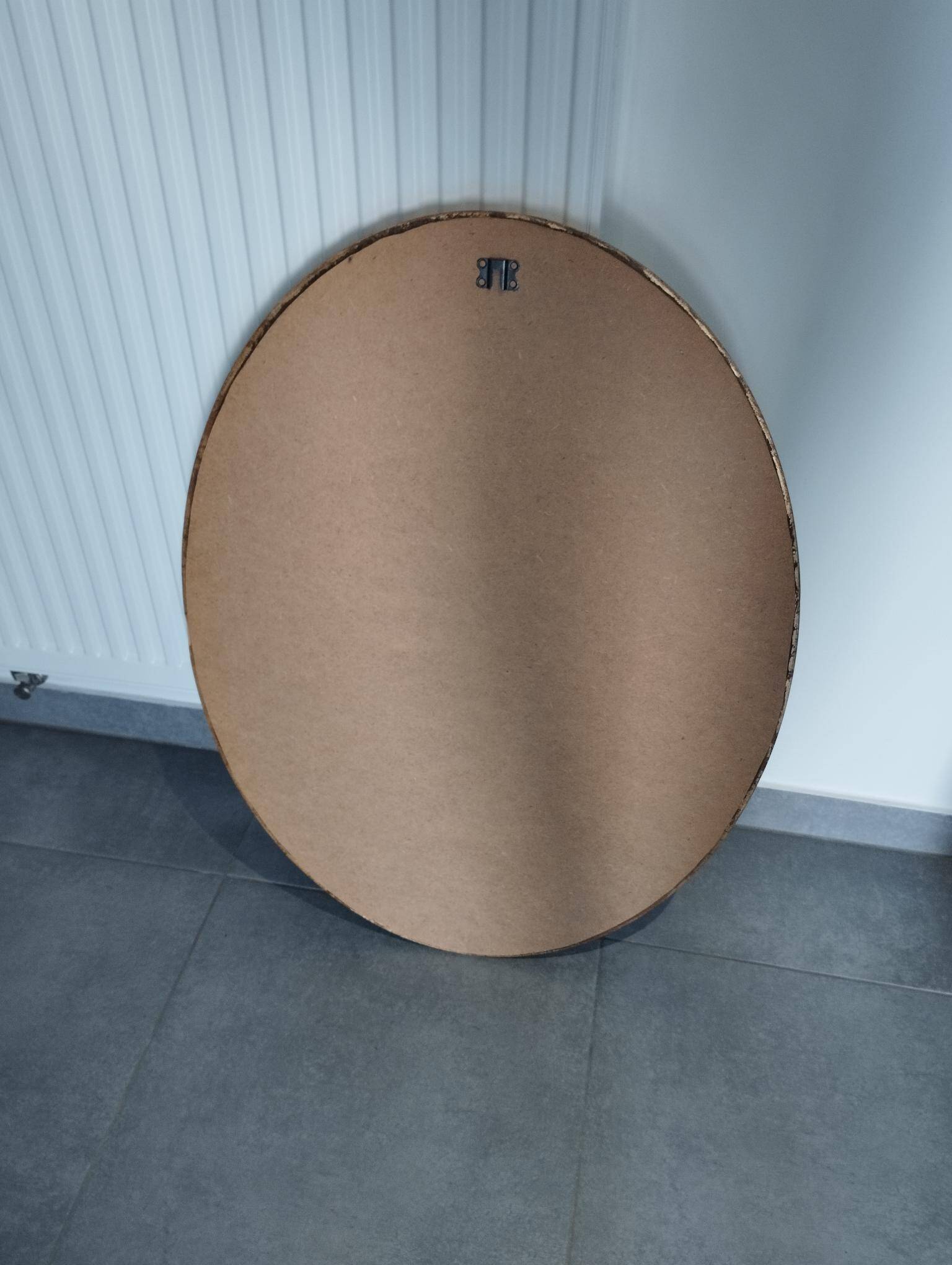Grand et élégant miroir doré ovale avec sa glace biseauté